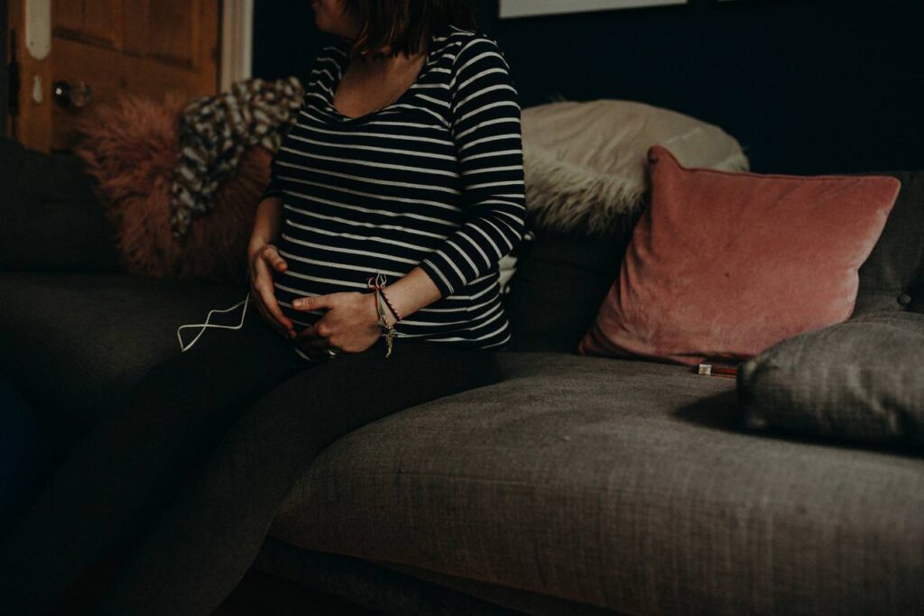 Plymouth home birth with mother breathing through contractions in the evening light