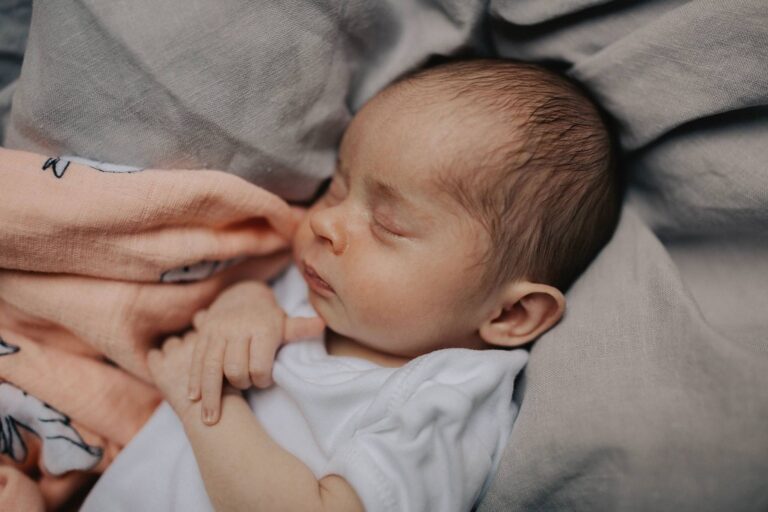 A close up of baby's face in soft natural light