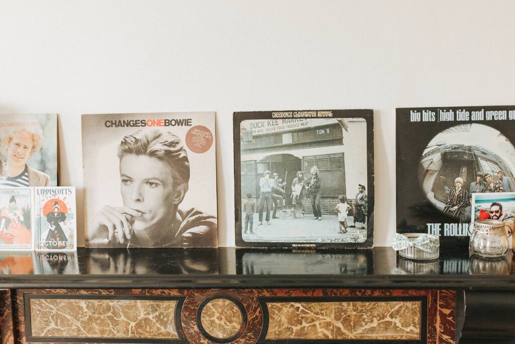 vinyl records lining a fireplace in a home in plymouth