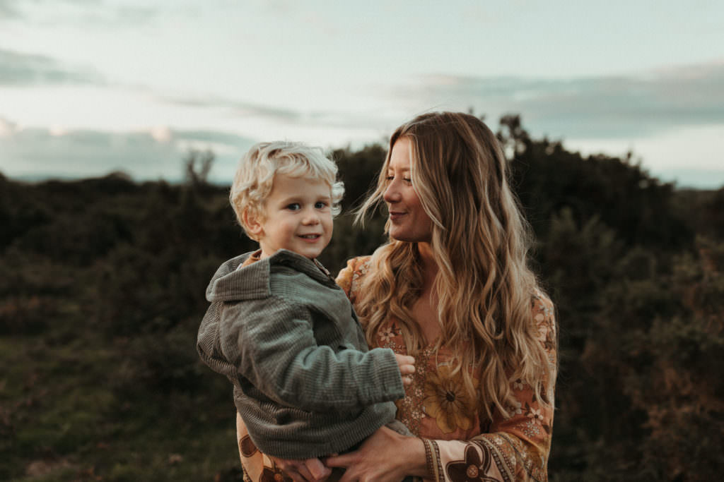 family photographer devon shoot Mum holding little boy and gazing at him
