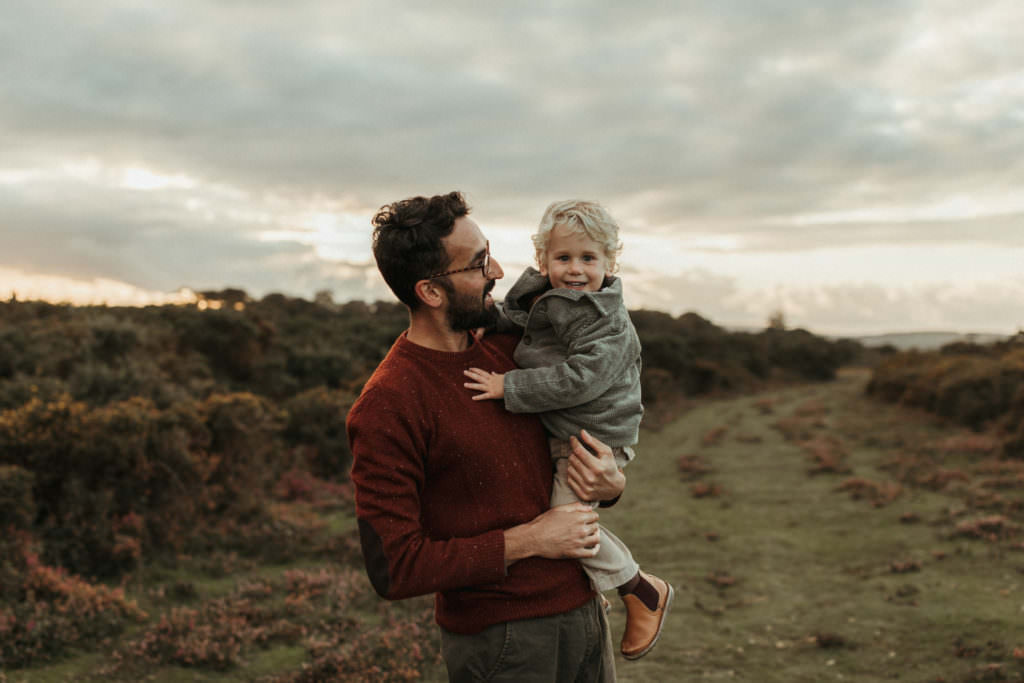 Dad holds son up family photographer devon shoot