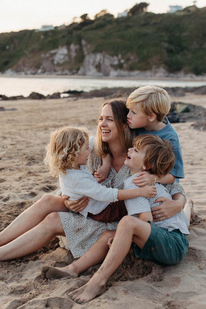 Cornwall family photography session of mother and children on beach by Melanie Grace Photographer