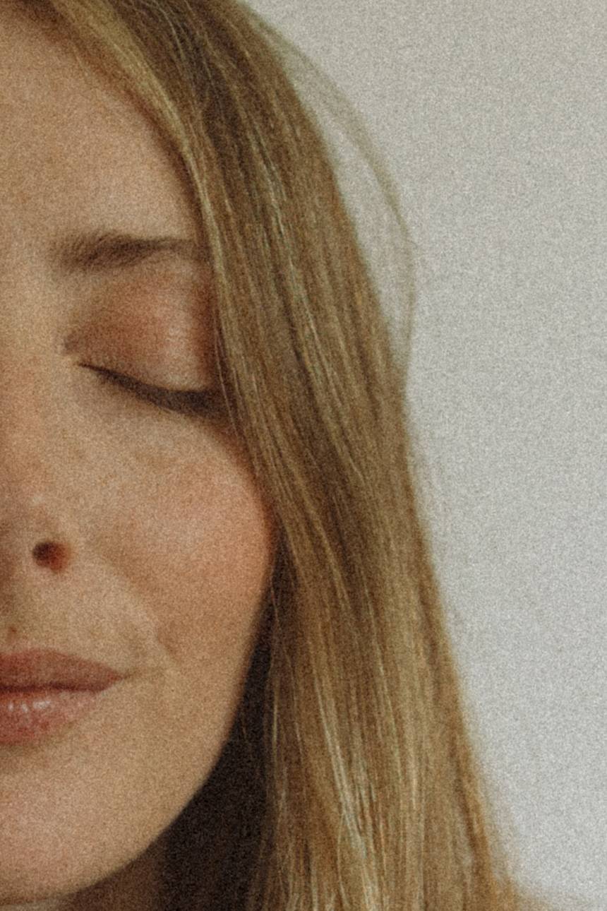 A close up of half of Melanie Grace Photographers face