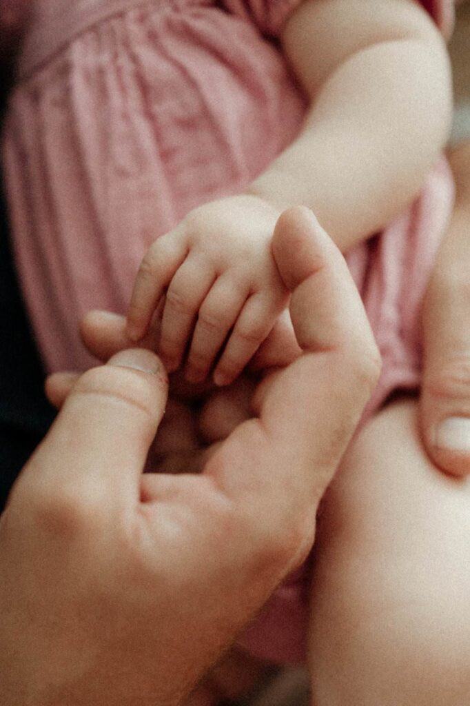 Close-up of baby fingers during baby photoshoot at home in Cornwall